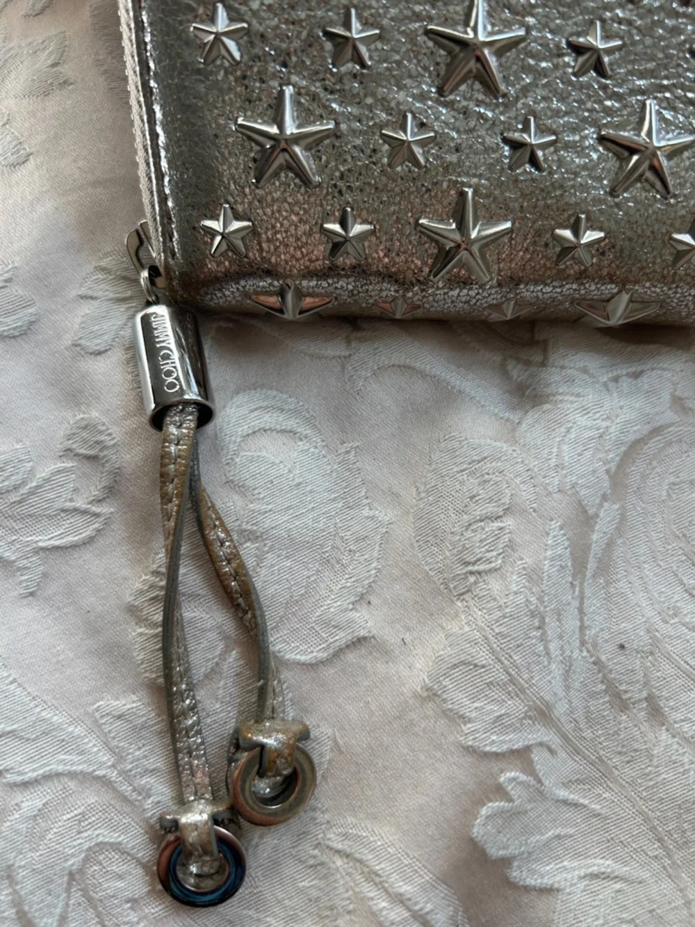 7021. Jimmy Choo Filipa Metallic Silver Star-Embellished Zip Around Wallet